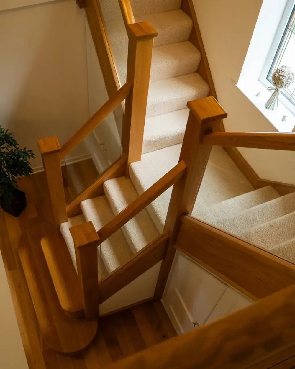 A Modern Oak and Glass Staircase Renovation by StairBox